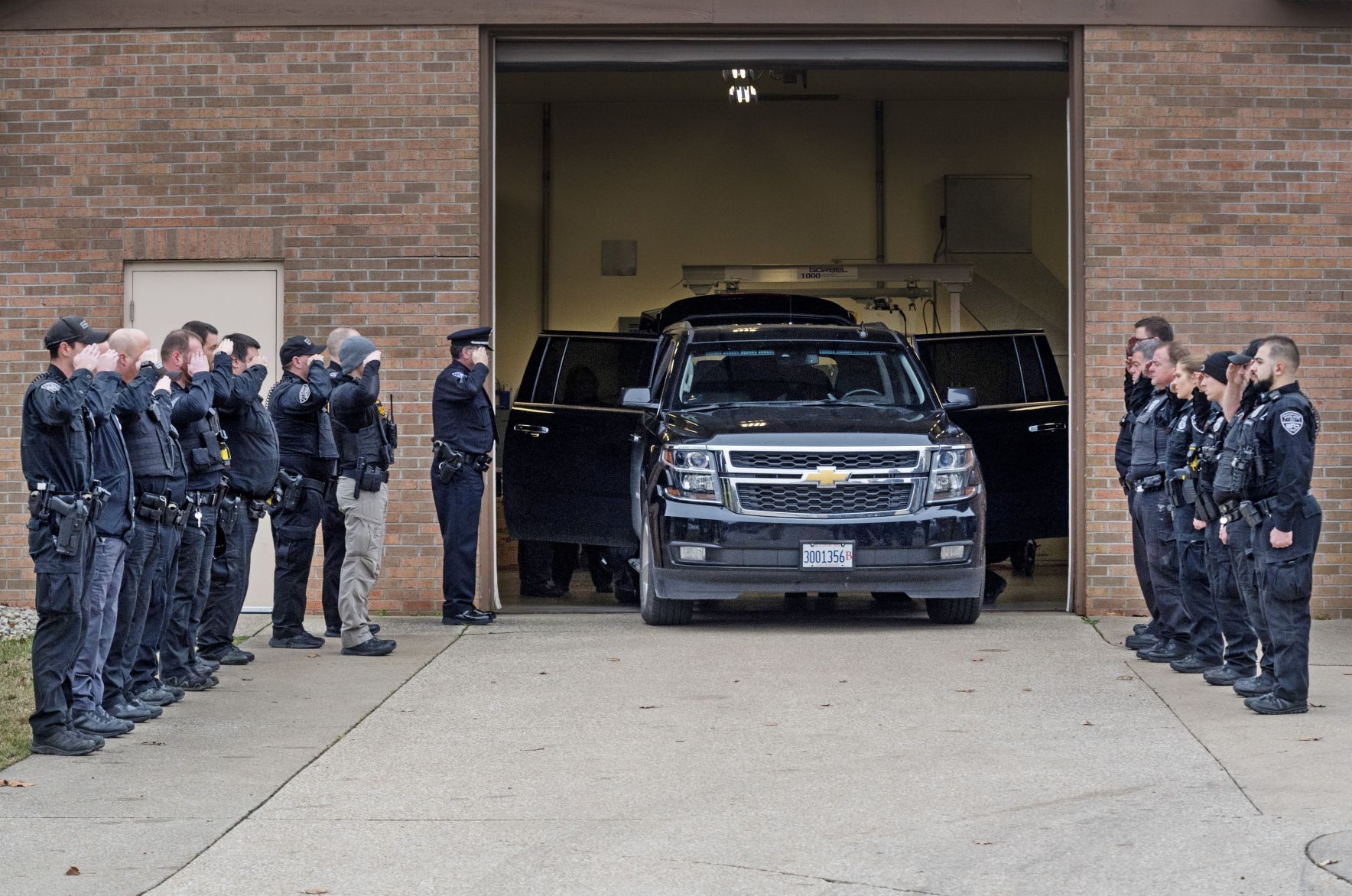 The body of Sean Riley departs Evansville